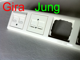 A Gira and a Jung wallmount in a Gira Plastic Cover (Pure white glossy)
